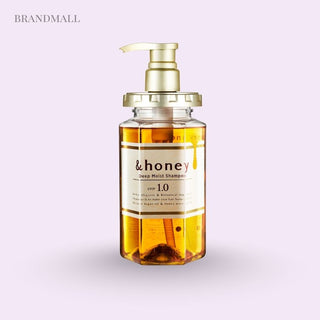 Bottle of '&honey' deep moist shampoo with a pump on a light purple background with text 'Brandmall'